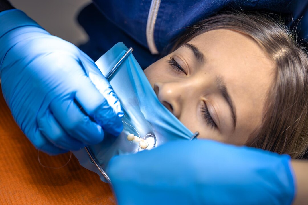 Dentist performing a procedure on a patient
